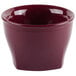 A red round Cambro insulated plastic bowl with a white lid.