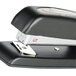 A close up of a Swingline 747 business stapler on a counter.