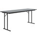 A rectangular Correll seminar table with gray granite top and black legs.