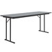 A rectangular gray granite Correll seminar table with off-set black legs.