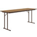 A brown rectangular Correll seminar table with metal legs.