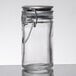 A Tablecraft clear glass salt and pepper shaker jar with a stainless steel clip-top lid.