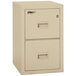 A tan FireKing two drawer file cabinet with two drawers.