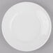 A Libbey round white porcelain plate with a wide white rim.