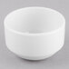 A Libbey Porcelana white bowl on a gray surface.