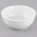 A white Libbey porcelain oatmeal bowl on a gray surface.