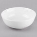 A white Libbey Porcelana noodle soup bowl on a gray surface.