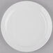 A Libbey narrow rim porcelain plate with a white rim on a gray surface.