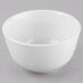 A Libbey Porcelana bright white porcelain noodle bowl on a gray surface.