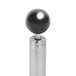 A silver metal egg topper with a black round ball on top.