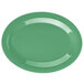 A close-up of a rainforest green oval melamine platter.