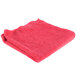 A red Unger SmartColor Microfiber cleaning cloth.