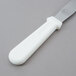 A white handled Tablecraft baking / icing spatula.