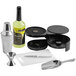 A Choice 7 piece Margarita Starter Kit on a counter with a metal container, a metal funnel, and a cocktail shaker.