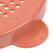 A pink plastic Cambro shaker lid with holes.