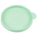 A green round plastic shaker lid with holes.