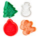 A group of Ateco Christmas cookie plunger cutters in green and white.
