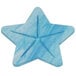 A blue star shaped object on a white surface.