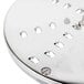 A silver metal Robot Coupe 3/16" grating / shredding disc with holes in it.