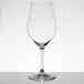 A clear Chef & Sommelier Bordeaux wine glass on a table with a white background.