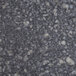 A close up of a grey and white speckled marbled surface.