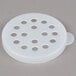 A white plastic shaker lid with holes.