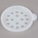 A white plastic lid with holes.