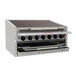 A MagiKitch'n stainless steel countertop charbroiler with four burners above a grill.