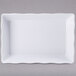 A white rectangular tray with wavy edges.