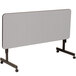 A grey Correll EconoLine rectangular table with wheels.