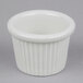 A white fluted ceramic bowl with a round rim.