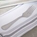 A 10 Strawberry Street Pearl stainless steel salad fork on a napkin.