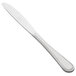A 10 Strawberry Street Pearl stainless steel dinner knife with a white handle.