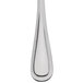A 10 Strawberry Street stainless steel teaspoon with a beaded handle.
