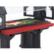 A red tray rail holding food on a salad bar.