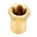 A close-up of a brass nut with a threaded brass nut in the middle.