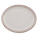 A white narrow rim china platter with brown speckles on the rim.