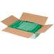 A brown box with green plastic bags.