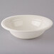 A Tuxton eggshell white china pasta bowl.