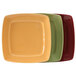 A group of square Tuxton china plates in assorted colors.