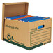 A brown Universal heavy-duty cardboard box with several files inside and a green recycle symbol.