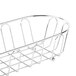 A Clipper Mill chrome metal long oval wire basket with a curved edge and a handle.