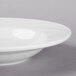 A Libbey bright white porcelain soup bowl with a wavy rim.