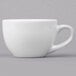 A close-up of a Libbey Basics bright white porcelain espresso cup with a handle.