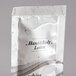 A white plastic bag of Dial White Marble hand and body lotion.