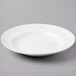 A Libbey bright white porcelain entree/pasta bowl on a white surface.
