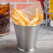 A Clipper Mill stainless steel mini pail filled with French fries.