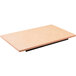 A rectangular natural solid Tablecraft double well cutting board on a table with a black base.