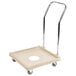 A Vollrath beige dish rack dolly with wheels and a handle.