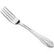An Acopa Monaca stainless steel European table fork with a silver design on the handle.